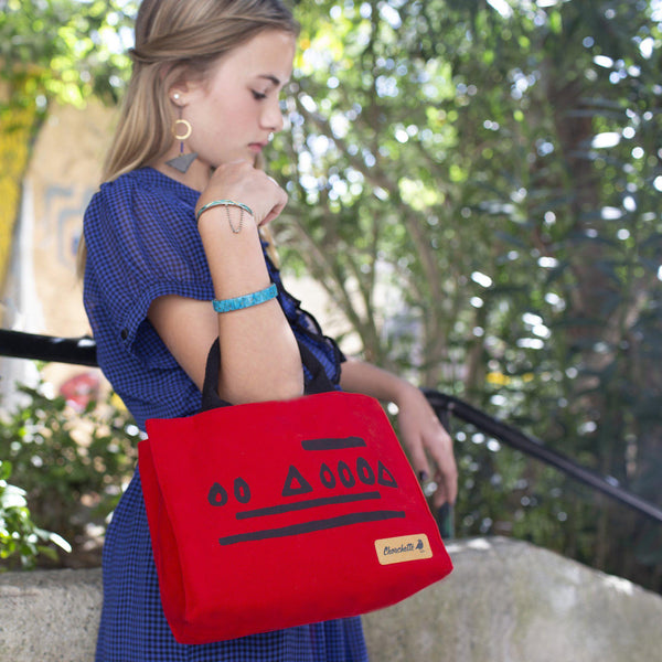 A woman wearing a red Hazelnut Waxed Canvas Mini Tote Bag, Shoulder Bag, Crossbody Bag-Devrim Studio