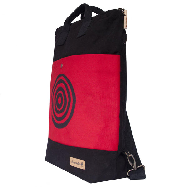 Side view of the red and black 'Time' Convertible Backpack, Tote Bag - Devrim Studio